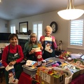 Arcie, Pat & Carol stuffing stockings